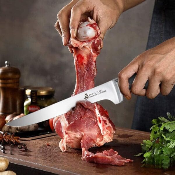 A person is cutting meat with a knife.