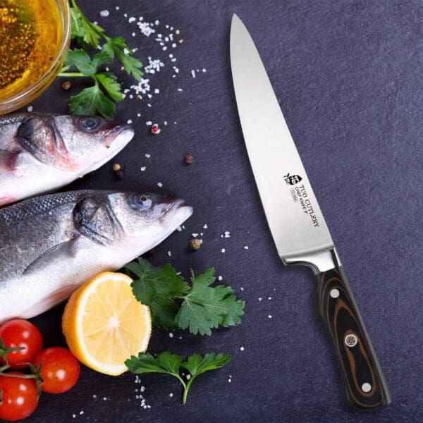 A knife and some fish on the table