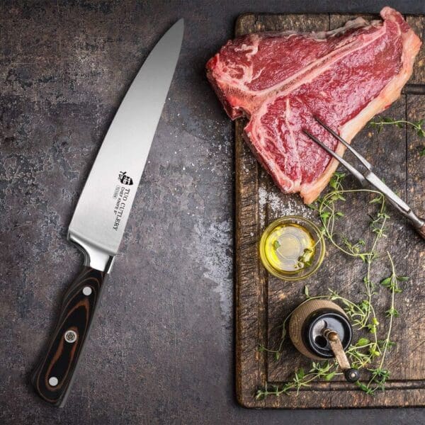 A knife and meat on a cutting board