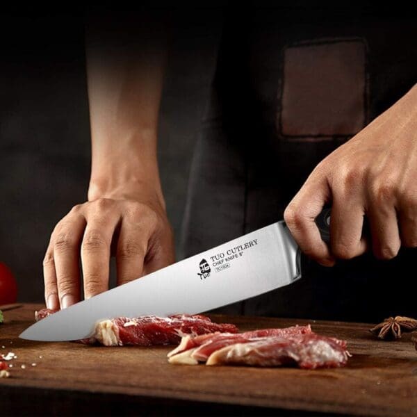 A person is cutting meat with a knife.