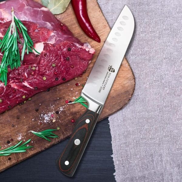 A knife and meat on a cutting board