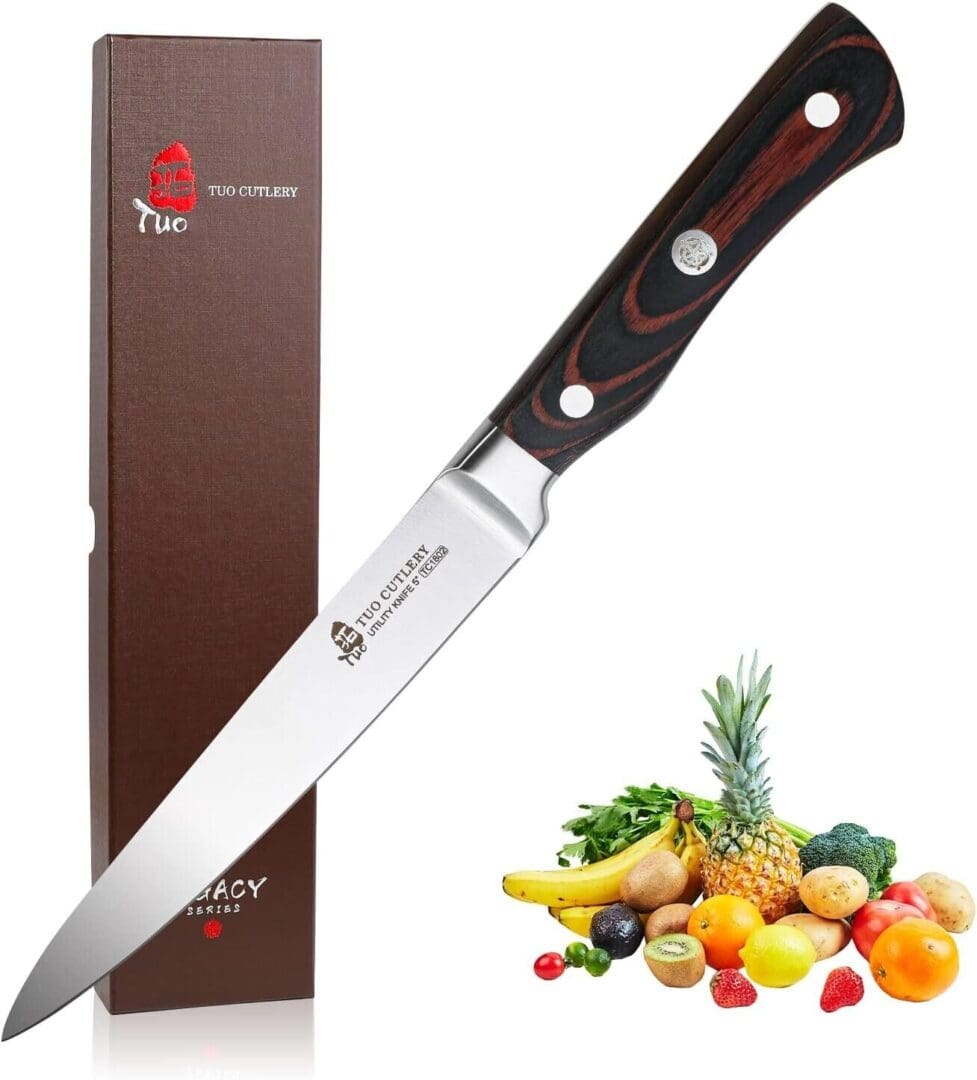 A knife with a box and some fruit