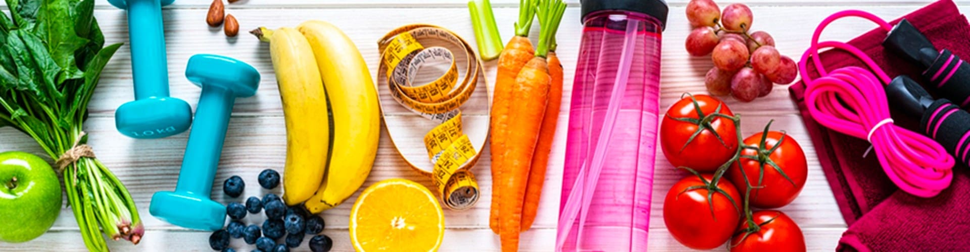 A close up of fruits and vegetables with measuring tape